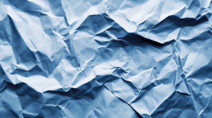 Fototapeta premium Crumpled sky blue paper texture background for design projects and creative applications