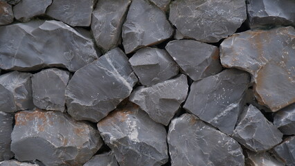 Full frame of large grey stone wall, Stone background