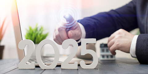 2025 Real Estate Innovation: Businessman Pointing Towards Digital Future with Housing Market Focus