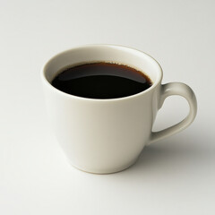 White ceramic coffee cup filled with dark brown coffee against plain white background
