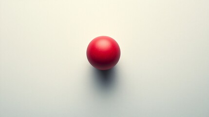 Solid red circle centered on a flat surface reflecting simplicity and focus