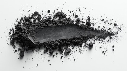 Charcoal powder spread on a clean white background showcasing texture and color suitable for product advertising and culinary use