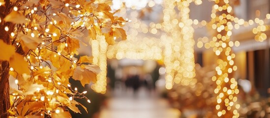 Soft glowing bokeh lights backdrop with autumn leaves creating a warm holiday atmosphere for celebration and festivity business use