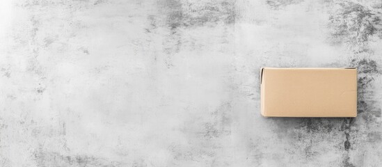 Gift box on gray concrete surface perfect for promotions and seasonal marketing campaigns