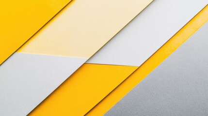 Geometric arrangement of light gray and yellow colored paper background with copy space for design and creativity purposes