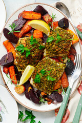Breadcrumb crusted cod fillet and baked root vegetables