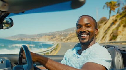 A man with a big smile driving a convertible along a sunny coastal highway, enjoying the freedom and thrill of the open road.