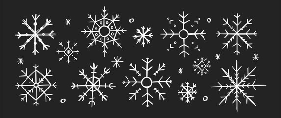 Hand drawn Christmas illustration of snowflakes with crayon or pencil texture. White doodle vector illustration on a blackboard.