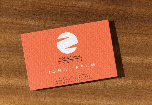 Business Card Displayed on Wooden Surface Withshadow