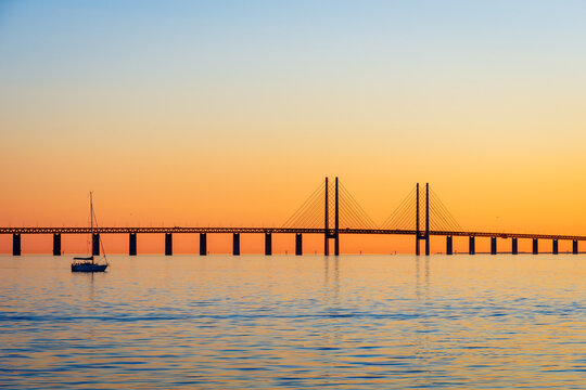 Sunset view of the Oresund bridge from the swedish shore, a railway and motorway cable-stayed bridge across the Oresund strait between Denmark and Sweden, opened to traffic in 2000.