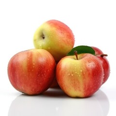 Four red and yellow apples with water droplets and green leaf.