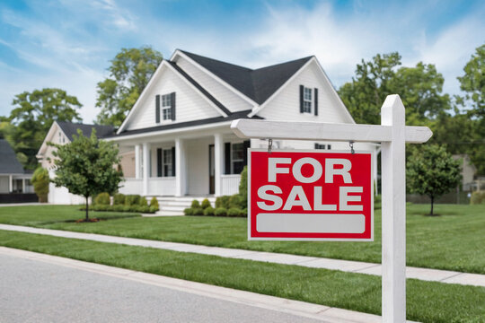 For sale sign in front of a new house