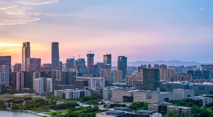 Fototapeta premium Modern city buildings and skyline at sunset in Ningbo, China