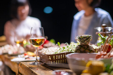 A table with a variety of food and drinks, including a pineapple