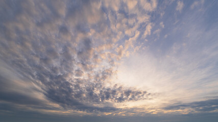panoramic view of a sky full with fluffy cloud shade with sunlight dramatic nature background