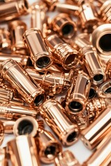 Naklejka premium Rose gold metallic cylinders piled high.