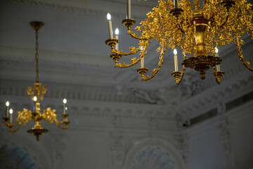 Gilded chandeliers in the wedding hall