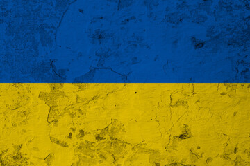 Ukrainain flag on a textured wall, national idendity, war crisis between Ukraine and Russia,...