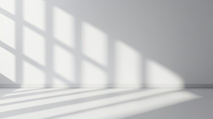 Obraz premium A minimalist interior scene featuring soft shadows cast on a white wall, creating a serene and calming atmosphere.