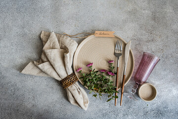 Elegant autumn table setting with rustic elements and flowers