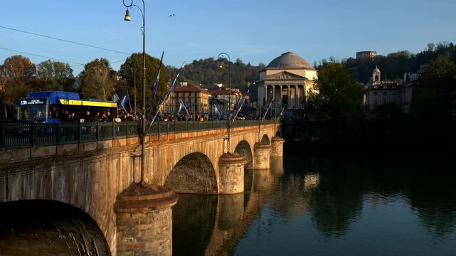 Italy, Turin, 11-10-2024. Gran Madre di Dio with famous bridge Vittorio Emanuele I in foreground. City of Turin. Slow motion 4K