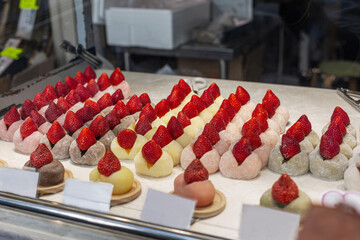 Japanese strawberry dessert on display in a cafe. Traditional Asian snack.
