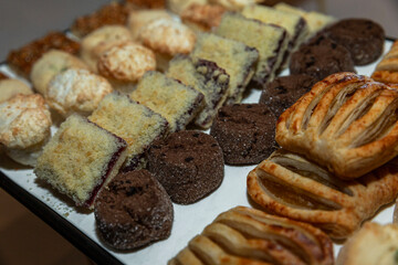 Various cookies on a tray on the table. Catering for events and holidays.