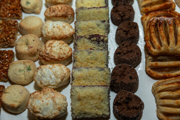 Various cookies on a tray on the table. Catering for events and holidays.