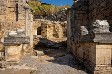 Fototapeta premium Rows of columns in Perge, Antalya, Turkey. Remains of colonnaded street in Pamphylian ancient city.Rows of columns in Perge, Antalya, Turkey. Ancient Kestros Fountain. Aksu, Antalya