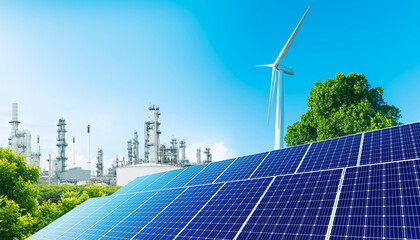Solar panel and wind turbine - Renewable energy for Green industry. Oil refinery plant, large Oil...