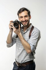 Obraz premium Portrait of a happy, smiling photographer with a camera.