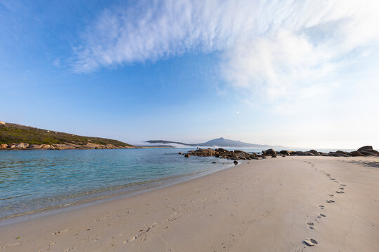 the shoreline with footprints at Bettys Beach