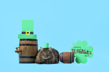 Cute cat in leprechaun hat with festive postcard and barrels of beer for St. Patrick's Day...