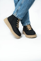 High boots, trendy winter shoes, isolate close-up place for text
