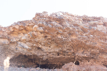 Close-up of a geological formation with distinct sedimentary rock layers, situated 50 km south of Marrakech, offering a glimpse into Morocco’s ancient natural history.