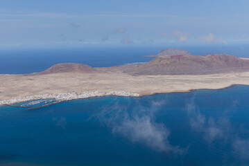 La Graciosa Island in the Canary Islands and the main town of Caleto Del Sebo, photo from the viewpoint of Mirador Del Rio.