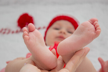 Soft feet of a newborn. Close-up of the fingers, heels and feet of a newborn.