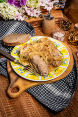 White sausage with stewed onion.