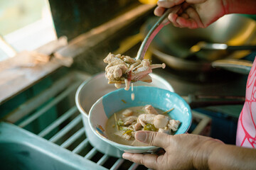 Woman savoring a delicious Thai meal, a colorful culinary adventure