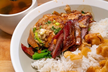 angle view soy sauce chicken and bbq pork rice with black chicken and cordyceps flower soup at horizontal composition
