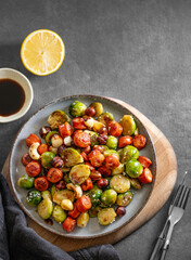 Brussels sprouts with chorizo ​​sausages, nuts and sesame seeds. Concept nutritious dish