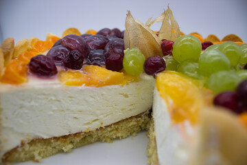Fruit-adorned Charlotte cake with layers.