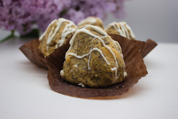 Close-up of homemade poppy seed pastry with icing drizzle