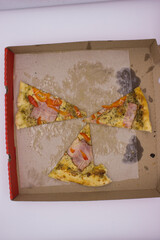 Three Pizza Slices Left in Cardboard Box