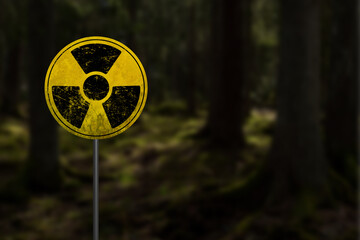 Nuclear radioactive danger sign in forest in Chernobyl exclusion zone around Chornobyl Nuclear...