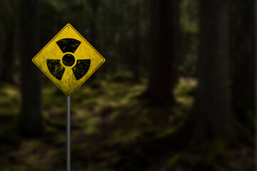 Nuclear radioactive danger sign in forest in Chernobyl exclusion zone around Chornobyl Nuclear...