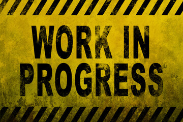 Temporary construction sign, warning workers. Old yellow warning sign with the text, work in...