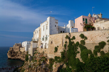 Traditional houses on dramatic cliffs rising from Adriatic sea in Polignano a Mare, Italy