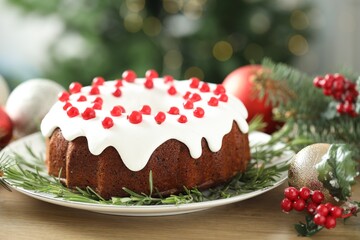 Traditional classic Christmas cake and decor on wooden table, closeup