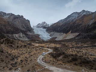 Driving off road car in high altitude mountains in tibet, China